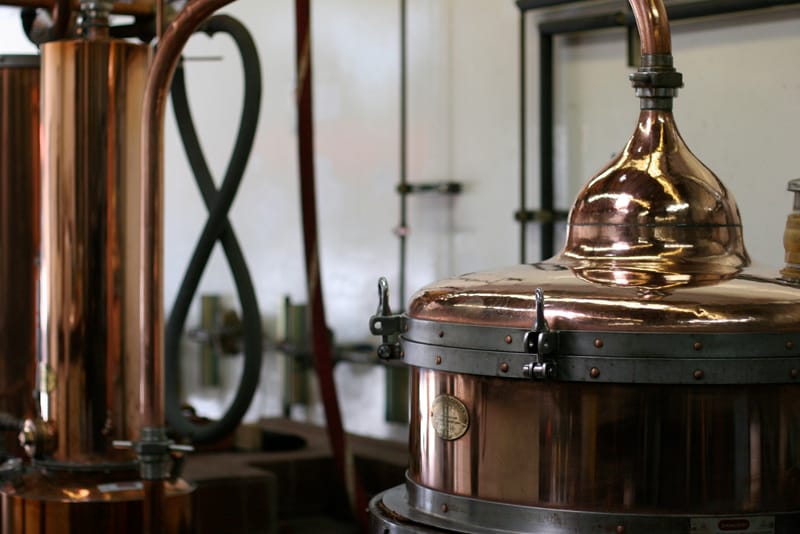 A close-up portrait of the chapiteau on the Essential Spirits custom-built alambic still.