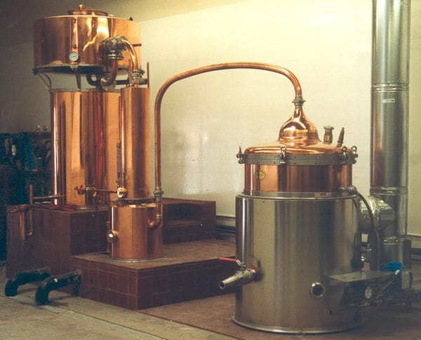 A close-up portrait of the chapiteau on the Essential Spirits custom-built alambic still.